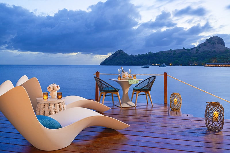 Sunset on an Over-the-Water Honeymoon Butler Bungalow deck at Sandals Grande St. Lucian