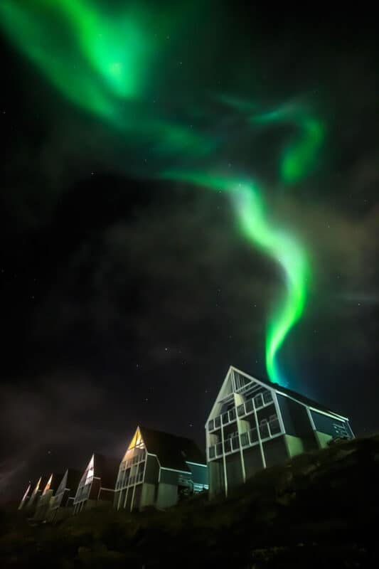 Green northern lights in Nuuk city, Greenland