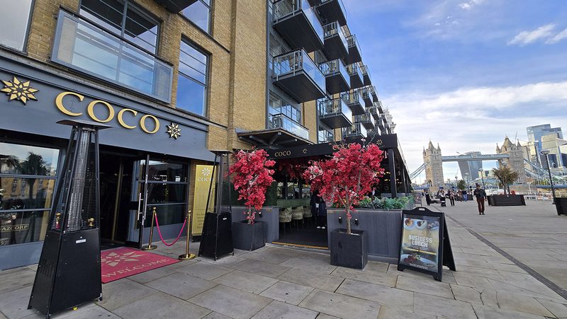 Entrance to Coco Grill with Tower Bridge in the background